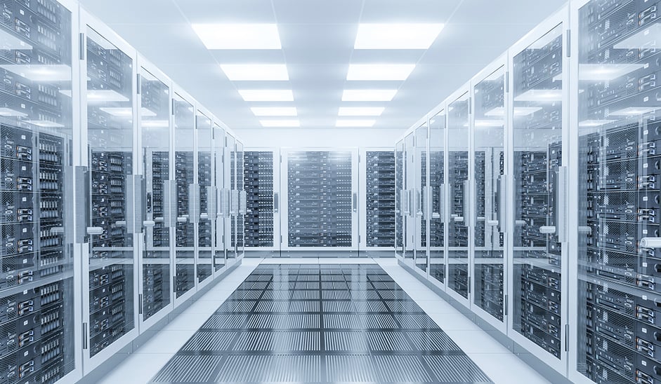 Servers lined up in brightly lit room