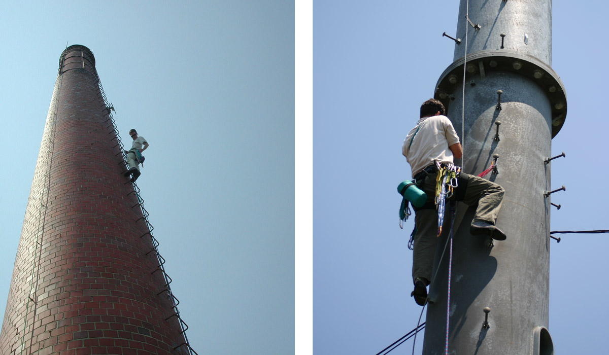 man climbing smoke stack and telephone pole