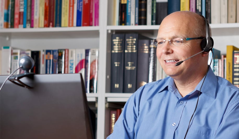 teacher doing video conference on headset