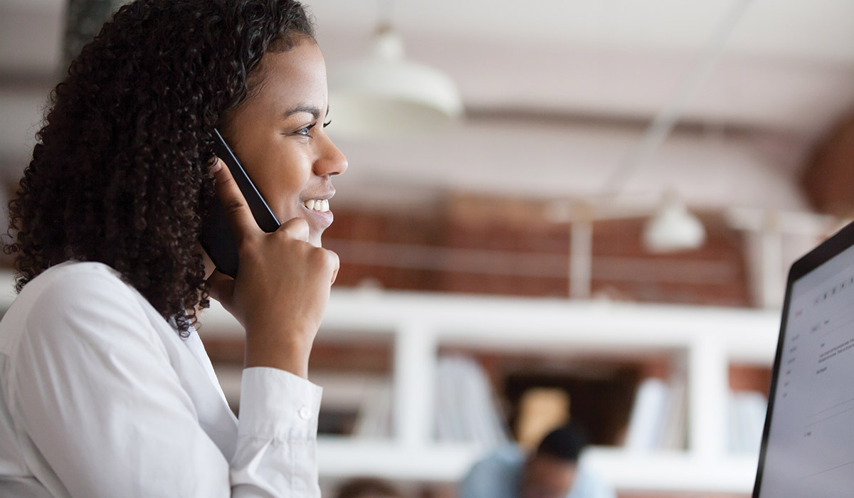 woman on phone in office setting