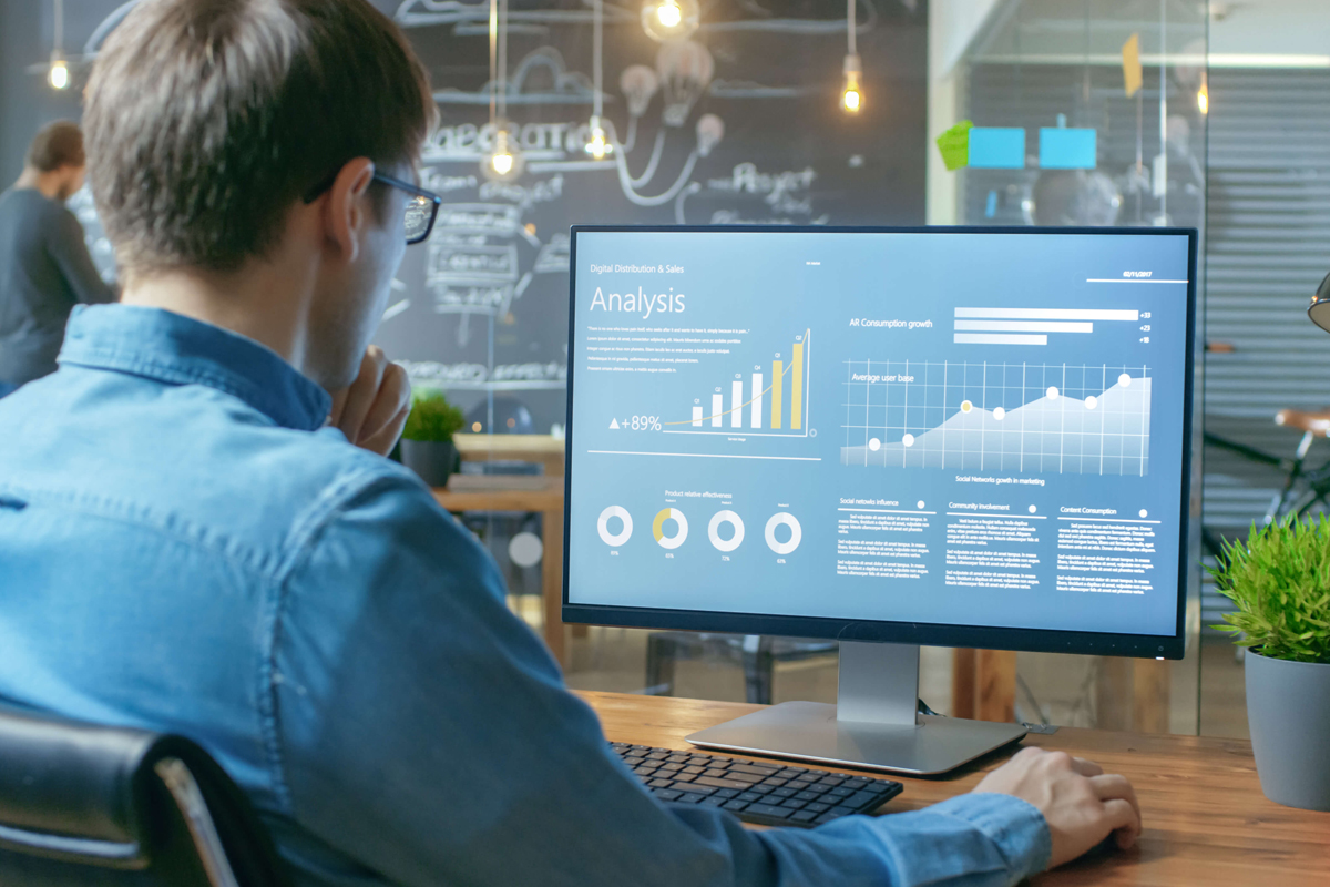 man looking at analytics dashboard on computer