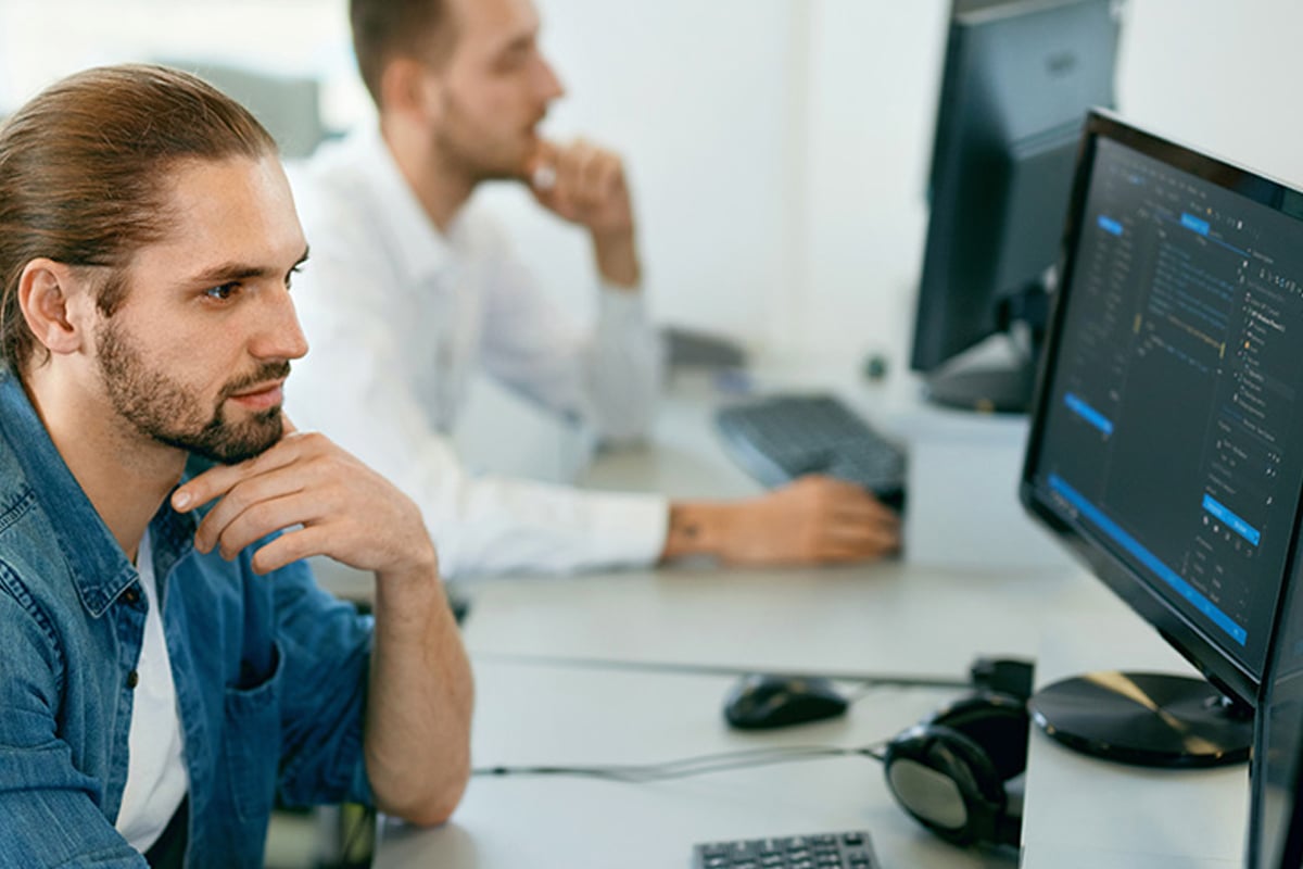 man looking at computer in the office