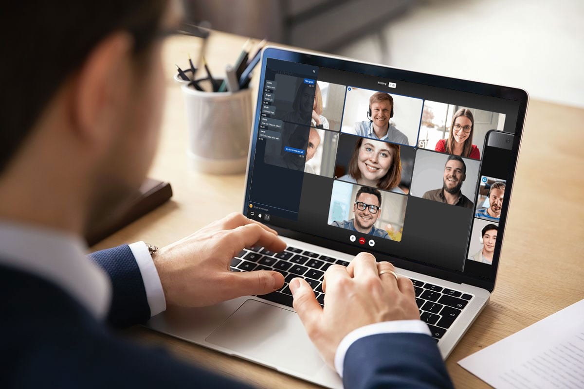 man using conference call software on laptop