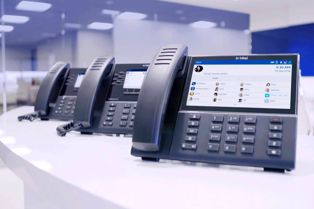 various mitel phones on table