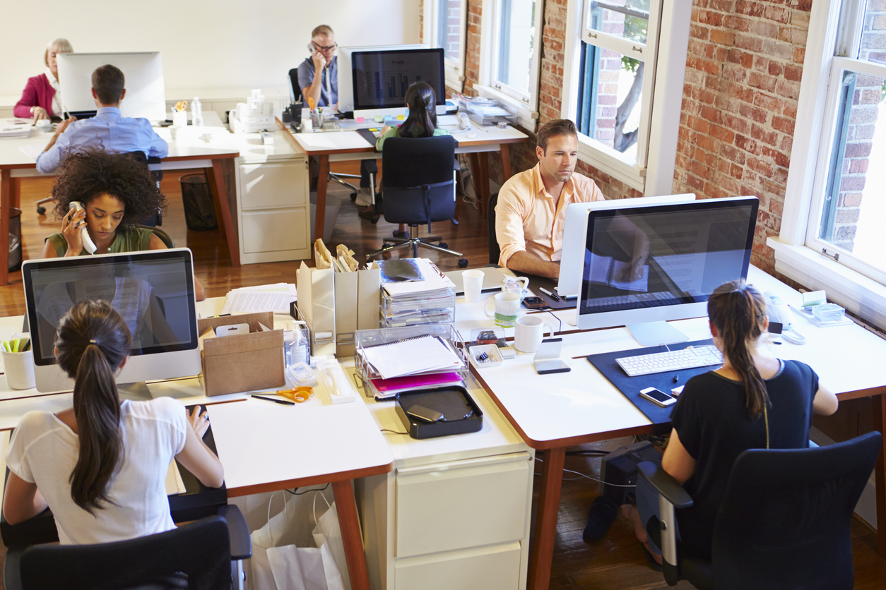 diverse employees working on computers in an office