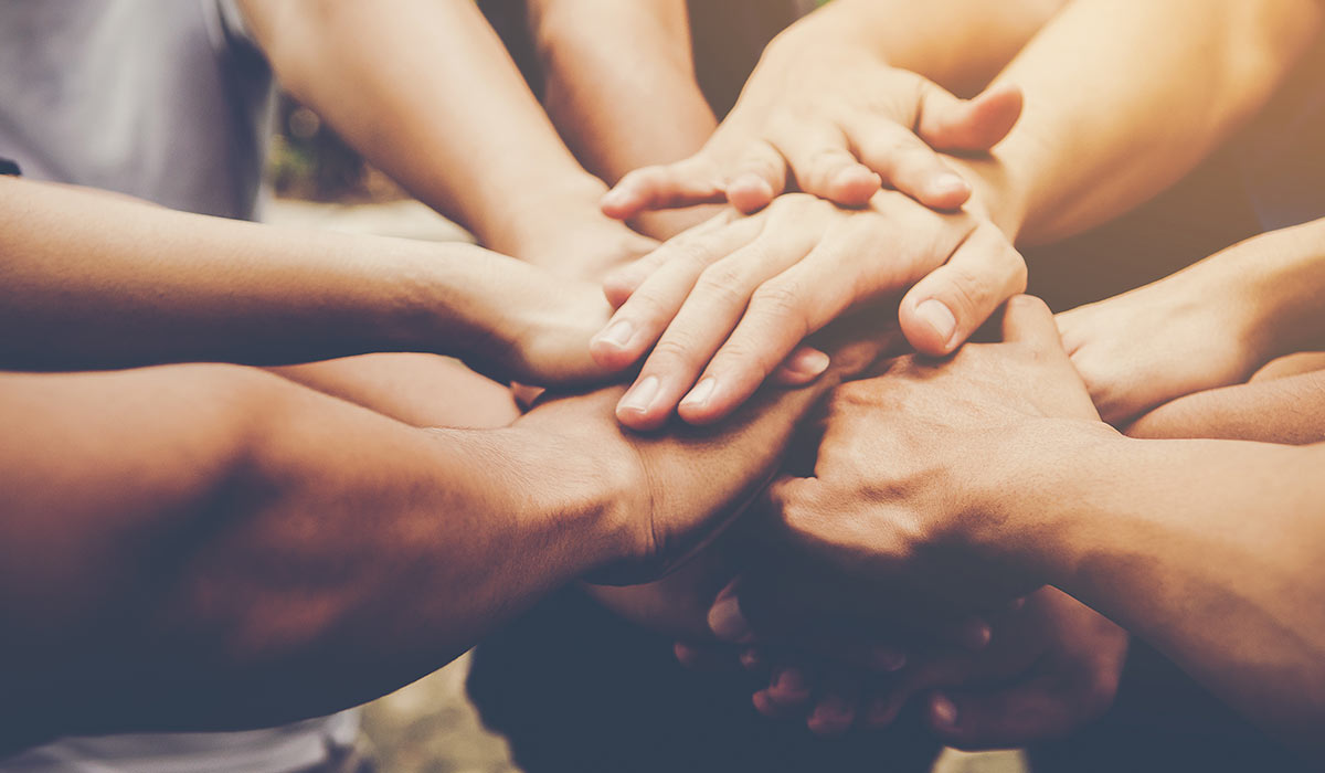 diverse hands joined together