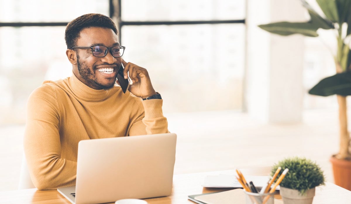 man using cell phone at the office